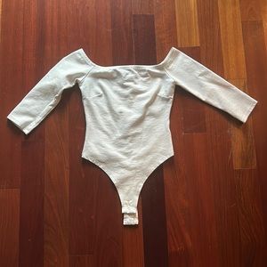 Size XS white off the shoulder body suit.